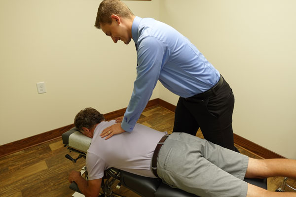 Chiropractor Marshfield WI David Schlinsog Adjusting Patient